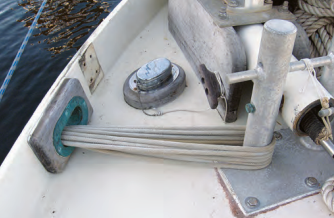 The bow hawsehole caused serious chafe the winter before, but the selvagee, made of smaller and more flexible Dacron line, protected the nylon dockline.