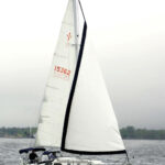 Jack and Anneke Wolf sail their Islander 36, Trillium, on Muskegon Lake, Michigan. The sleek lines of this 40-year-old design have lost none of their appeal.