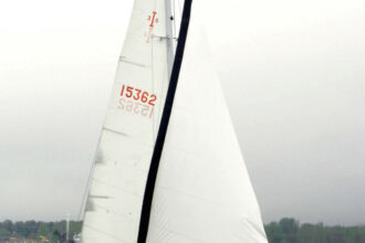Jack and Anneke Wolf sail their Islander 36, Trillium, on Muskegon Lake, Michigan. The sleek lines of this 40-year-old design have lost none of their appeal.