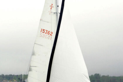 Jack and Anneke Wolf sail their Islander 36, Trillium, on Muskegon Lake, Michigan. The sleek lines of this 40-year-old design have lost none of their appeal.