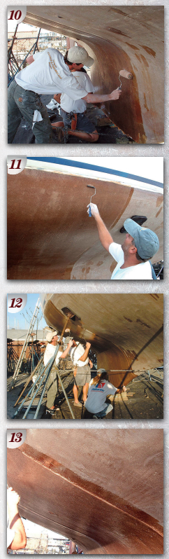 As each layer was added, the crew worked diligently to wet out the fabric (PHOTO 10) and remove excess resin and air from the material (PHOTO 11). In this stage of the process, it’s important to remove all the air, leave no voids, and work excess resin out of the cloth to ensure that the correct resin-to-glass ratio is achieved (PHOTO 12). A close-up view of the new laminates shows the thickness attained as each area of the hull was covered with new cloth (PHOTO 13).