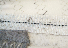 Mildew, which often appears as black specks, degrades sailcloth biologically.