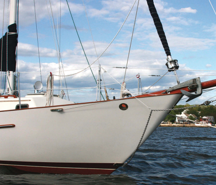 Saudades, a Pacific Seacraft 34, wears her bowsprit proudly. When she's on her mooring, Michael pulls the bobstay aside so the mooring line does not chafe on it.