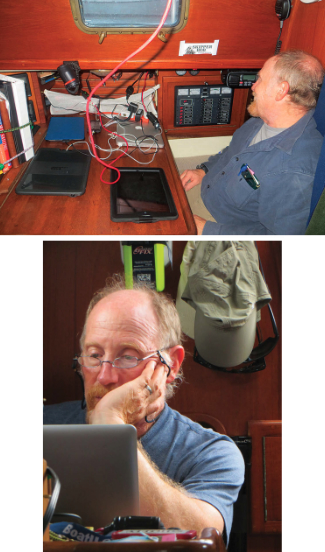 With all the devices drawing on the boat’s batteries, Bob had to keep an eye on their state of charge, above. Bob at work at the nav station, below.