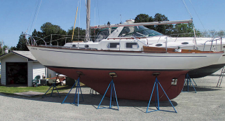 The mast is gray and unpainted. The anodizing was lost many years ago. John says he could polish it or paint it but that would require more time each year to maintain.