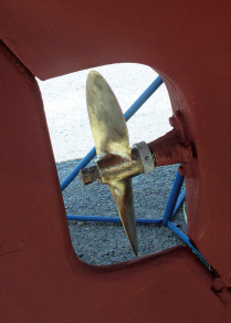 When he switched from the gas engine to diesel, John had to replace the propeller. This one is now in its fifth season, and John likes to give it a good polish in preparation for the annual war on barnacles.