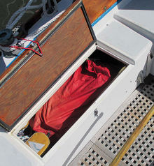 All three folded jibs fit in the port sail locker, at left, along with sheets, guys, and so on. The winches and deck layout are original and work fine for cruising purposes. John installed turning blocks with the intention of adding new self-tailing primary winches, but then backed off due to sticker shock.