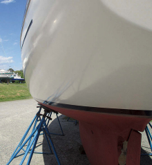 The original 1967 white topsides gelcoat is hand buffed and still shines, above, even if it is no longer a mirror finish.