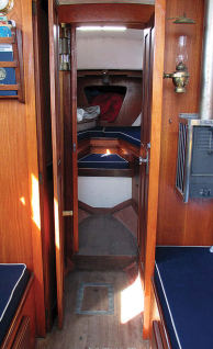 The standard Alberg 30 layout has four real bunks with a head and hanging locker between the two cabins, at left. John calls it “1950s CCA Mk I.” The main saloon berths are the sea berths and have stowable lee cloths for sleeping under way when heeled.
