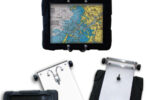 When Gary started using navigation apps on his iPad, he modified the swing-out arm he already had, at top, to hold a protective case for it, at left and above. Robe hooks mounted on a StarBoard panel secure the case.