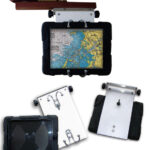 When Gary started using navigation apps on his iPad, he modified the swing-out arm he already had, at top, to hold a protective case for it, at left and above. Robe hooks mounted on a StarBoard panel secure the case.