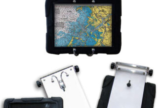 When Gary started using navigation apps on his iPad, he modified the swing-out arm he already had, at top, to hold a protective case for it, at left and above. Robe hooks mounted on a StarBoard panel secure the case.