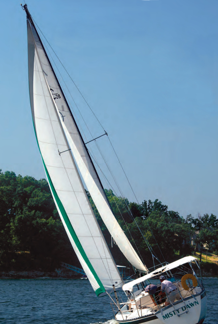 Gary and Cathy Gray sail their Caliber 28, Misty Dawn, on a large man-made lake in oklahoma.