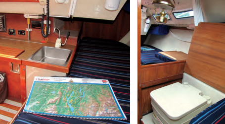 The compact galley is under the bridge deck, at left, and the saloon settees extend under the cockpit. A portable toilet fits under a fold-down lid at the aft end of the V-berth, at right.