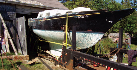 Walter had to cut the lintel over the barn door before hauling the boat out of the barn, and then had to coax her, cradle and all, onto the trailer.