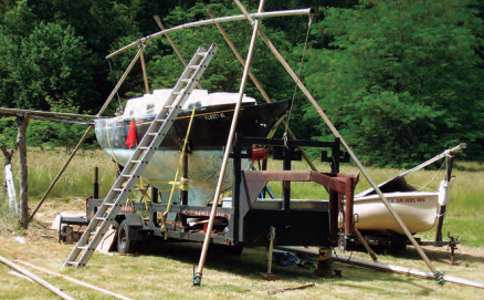 The Nantucket Clipper sits next to Walter’s Flying Scot under the partially erected frame for a cover.