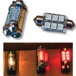 To increase the arc of emitted light and make it brighter, Clarence originally glued and wired together two LED festoons, above left. His new panel of six very bright LEDs on a festoon base, above right, emits light through a 120-degree arc and is much brighter than the original two festoons with a total of 18 smaller LEDs. The difference in brightness is quite apparent, below, when comparing the original 10-watt incandescent bulb (left), two festoons with 18 LEDs (center), and the new LED panel with six LEDs (right).