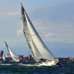 A chilly and stiff northerly wind set the tone as the Good Old Boat Regatta fleet beat out of the lee of downtown St. Petersburg and toward the weather mark.
