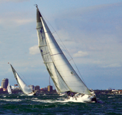 A chilly and stiff northerly wind set the tone as the Good Old Boat Regatta fleet beat out of the lee of downtown St. Petersburg and toward the weather mark.