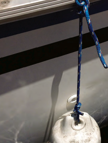 On a boat that has perforated toerails, Ferman’s idea of hanging the fenders from them with carabiners is a smart and quick solution.