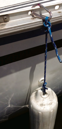 On a boat that has perforated toerails, Ferman’s idea of hanging the fenders from them with carabiners is a smart and quick solution.