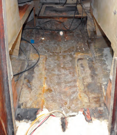 Bert cut away the old engine beds and prepared the space to receive the bed for the saildrive combination.