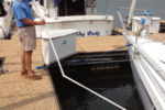 Ferman demonstrates how he can clean his boat’s bottom while she’s in her slip.