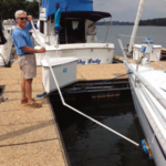 Ferman demonstrates how he can clean his boat’s bottom while she’s in her slip.