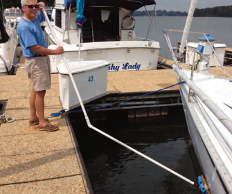 Ferman demonstrates how he can clean his boat’s bottom while she’s in her slip.