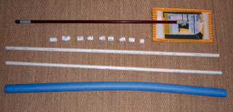 The basic parts of the hull cleaner are a swivel-head floor sweeper, PVC pipe and sundry fittings, and a pool noodle.
