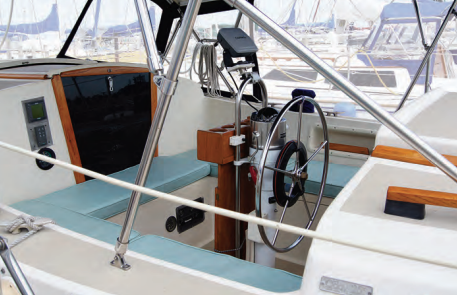 The center cockpit is reasonably comfortable with properly angled seatbacks, but without a bridge deck aft there is no place for the helmsman to sit directly behind the wheel.