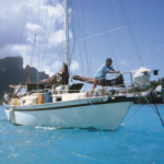Janet sets the anchor in Bora Bora. Apogee is equipped with a manual anchor windlass with a long handle to provide leverage.