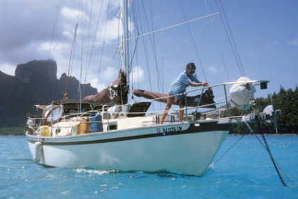 Janet sets the anchor in Bora Bora. Apogee is equipped with a manual anchor windlass with a long handle to provide leverage.