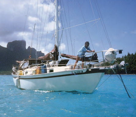 Janet sets the anchor in Bora Bora. Apogee is equipped with a manual anchor windlass with a long handle to provide leverage.