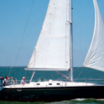 The dark green hull of Irish Rover, owned by Ted and Lynn Ambers of Polk, Ohio, shows off the sleek, aggressive lines of the Hunter Legend 37.