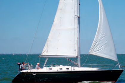 The dark green hull of Irish Rover, owned by Ted and Lynn Ambers of Polk, Ohio, shows off the sleek, aggressive lines of the Hunter Legend 37.