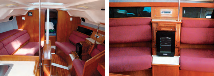 Few upgrades improve the look and feel of an interior more than reupholstered cushions, nicely done here with tucks to create visual interest and added padding behind the knees, at left. Owner Ted Ambers removed the electronics from the entertainment center that separates the two starboard settees in the saloon, at right, and installed a wine cooler.