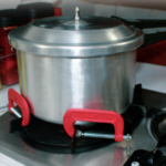 When a pot needs restraining on a stovetop that has no fiddles, a couple of C-clamps can save the stew.