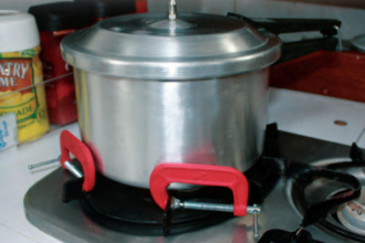 When a pot needs restraining on a stovetop that has no fiddles, a couple of C-clamps can save the stew.