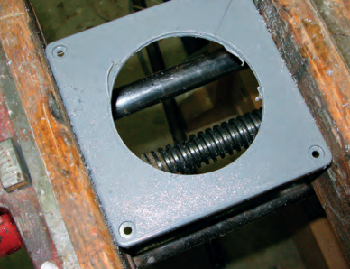 Al cut a 31/2-inch diameter hole in the junction box cover to accept the back of the control head.