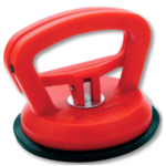 A dent puller grips the curved surface of a boat’s hull firmly and releases easily.