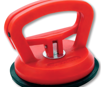 A dent puller grips the curved surface of a boat’s hull firmly and releases easily.