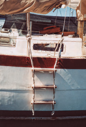 Richard transformed a plank retrieved from the harbor and a couple of lengths of three-strand rope into a practical and effective ladder.
