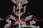 Picture of a boat with christmas jolly roger lights