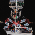 Picture of a boat with christmas jolly roger lights