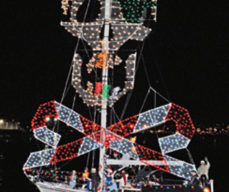 Picture of a boat with christmas jolly roger lights