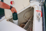 A self-draining anchor locker is a ready-made location for a quick-and-easy storage container for propane canisters.