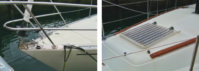 At the bow there is a small anchor locker, two cleats, and a tiny roller for handling ground tackle, at left. The forward hatch, at right, located on the coachroof above the entrance to the forward cabin, is a little too far aft to bring much breeze to crew sleeping on the V-berth.
