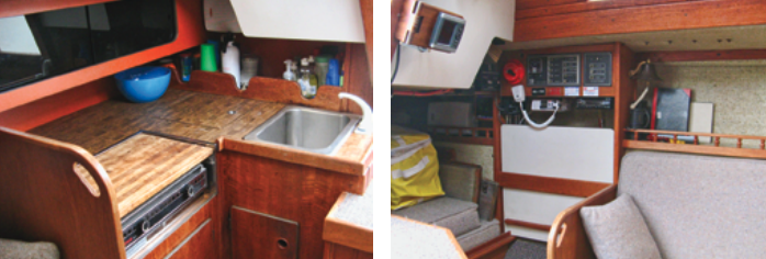 The compact galley, at left, is fitted out with an Origo alcohol stove, a small sink, and an icebox. The nav desk, at right, is cleverly designed to lift up and out for use. It is stowed against the hull and a cushion takes its place when the quarter berth is needed.
