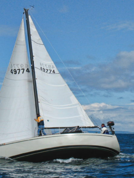 With the mainsail and genoa drawing well, Greg Pearson’s S2 9.2A, Blast, moves quickly upwind on the gray waters of Puget Sound.